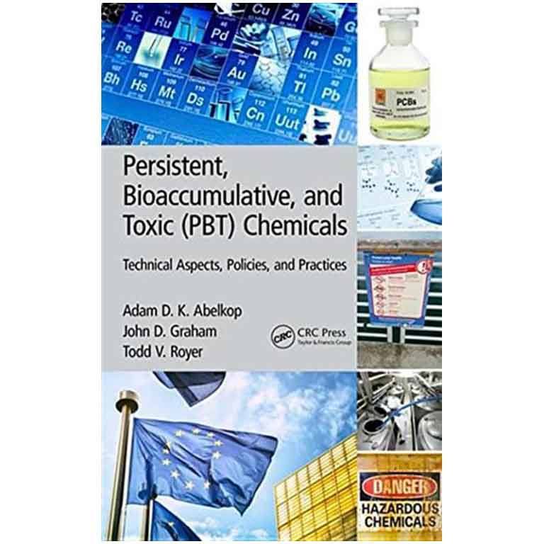 James Barnes in front of a wall of photos. 