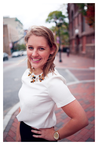 James Barnes in front of a wall of photos. 