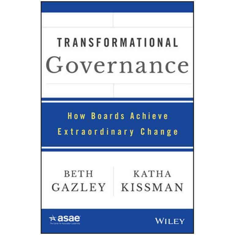 James Barnes in front of a wall of photos. 