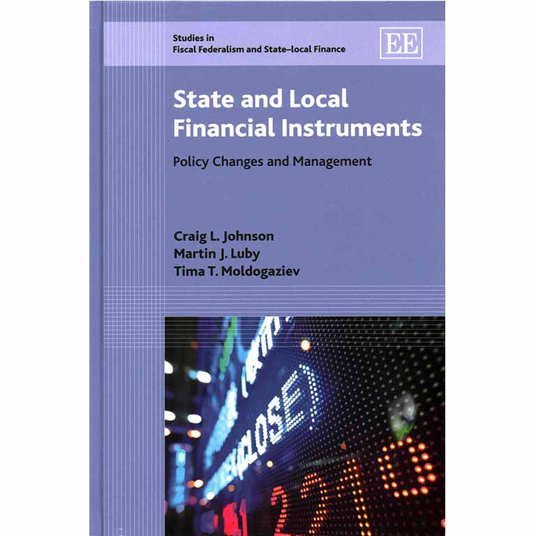 James Barnes in front of a wall of photos. 