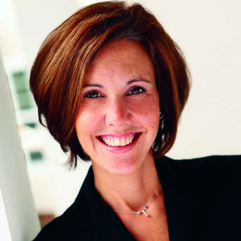 Alumnus Smalley puts his hand on his heart. 